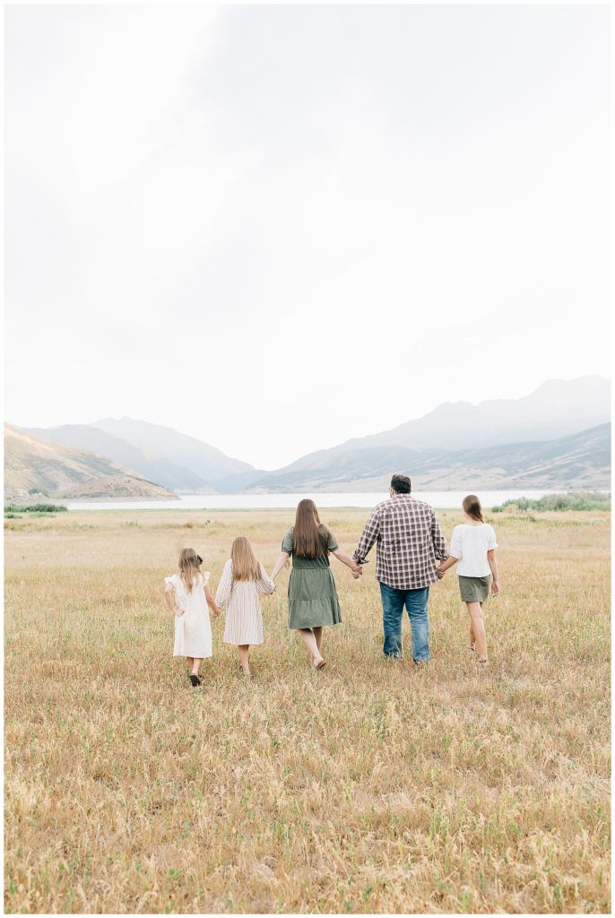 family walking toward the mountains in Midway, Utah