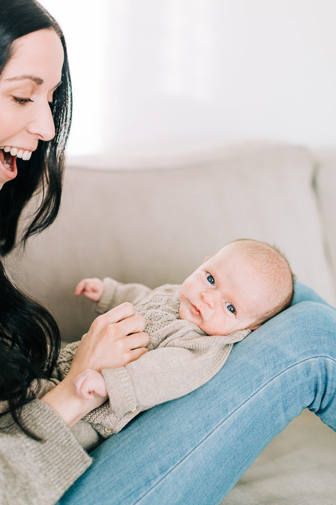 Utah photographer Kailee Matsumura captures a precious moment of a mother playing with her baby boy. mother and baby portraits #KaileeMatsumuraPhotography #SLCphotographers #motherhood #newbornphotography #Utahfamilyphotography #babyportraits