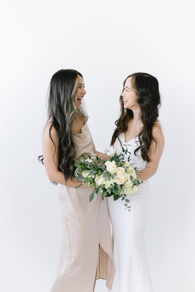 Bride with bridesmaid in a studio in Salt Lake City, Utah for an elopement. #KaileeMatsumuraPhotography #KaileeMatsumuraWeddings #Studiowedding #UtahWedding #SLCwedding #SLCweddingphotographer
#WeddingphotographerinSLC
