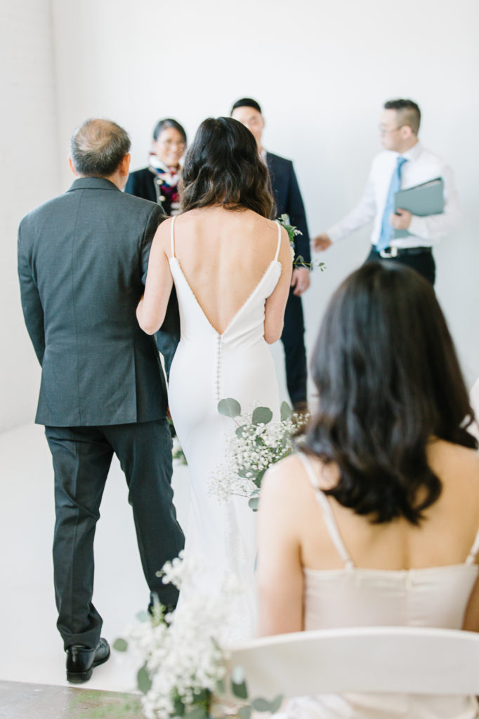 A father walks his daughter down the aisle in a studio elopement in Salt Lake City, Utah. #KaileeMatsumuraPhotography #KaileeMatsumuraWeddings #Studiowedding #UtahWedding #SLCwedding #SLCweddingphotographer
#WeddingphotographerinSLC