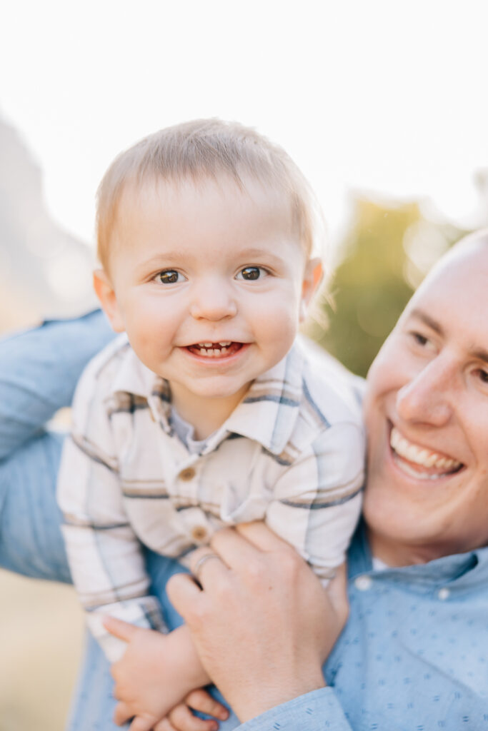 father and son photo. Father and toddler son. Father and son in blue and white. Shy kids and family photos. How to make shy kids smile. Memphis Family Photographer. 