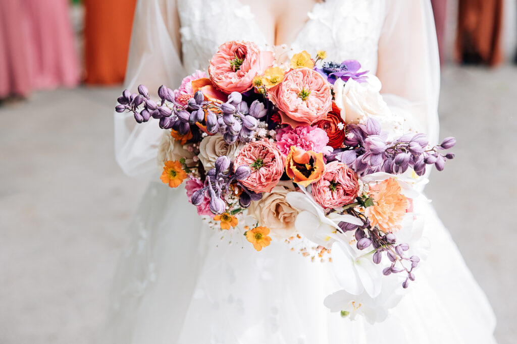 Kailee Matsumura Photography a professional Memphis wedding photographer captures a colorful summer bridal bouquet with purples and pinks. summer bridal bouquet colorful wedding #KaileeMatsumuraPhotography #Bartlett,TN #MemphisPhotography #KaileeMastumuraWeddings #TNweddingphotography #summerwedding #colorfulwedding