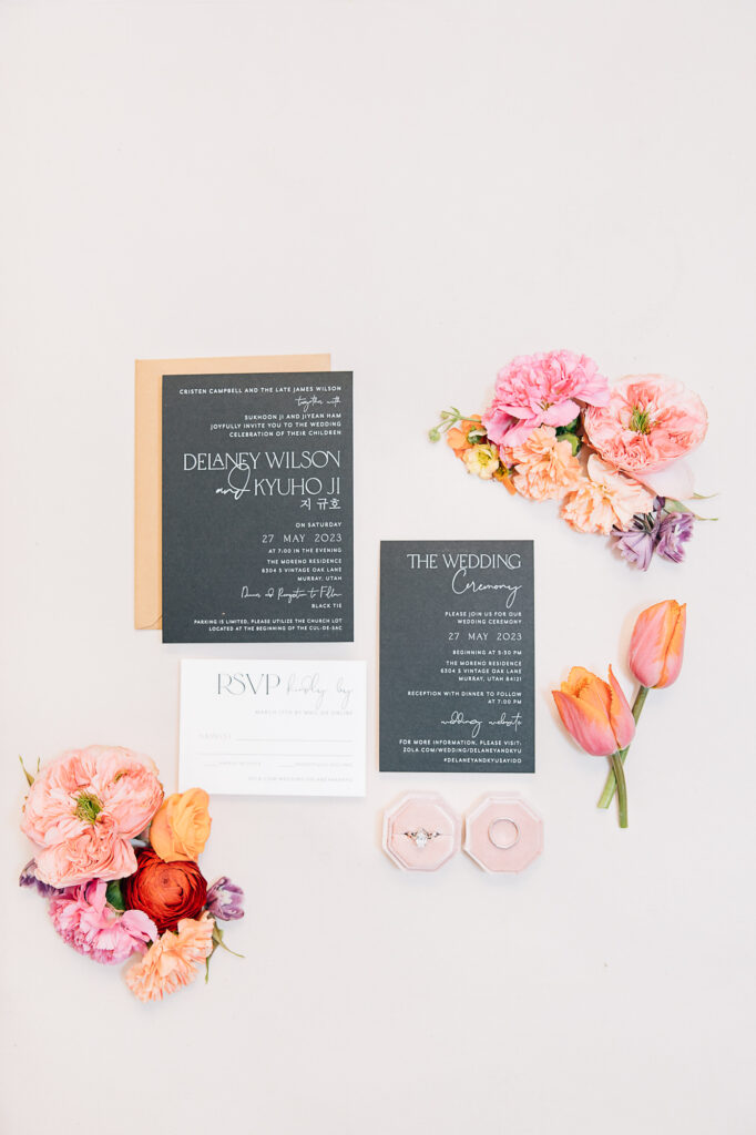 Kailee Matsumura Photography captures a flat lay wedding photo of the announcements, wedding rings and florals. summer southern wedding flat lay announcement #KaileeMatsumuraPhotography #Bartlett,TN #MemphisPhotography #KaileeMastumuraWeddings #TNweddingphotography #summerwedding #colorfulwedding #flatlay
