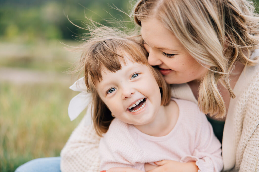 Family photos are always worth it even when life is busy. Mother and daughter snuggling together and smiling. #KaileeMatsumuraPhotography #Tenneseefamilyphotographer #whyfamilypicturesareworthit #familyphotoinspo #TenneseePhotographers #Memphisphotographer #reasonstotakefamilyphotos #bartlettphotographer