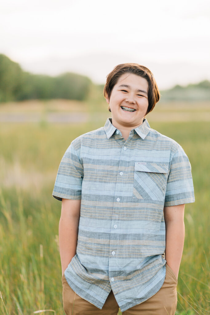 A very sweet, happy pre-teen smiles showcasing being in the braces phase of life as captured by Kailee Matsumura Photography. Blue striped dress shirt teen outfit inspiration
#KaileeMatsumuraPhotography #MemphisFamilyPhotographer #ReasonsToTakeFamilyPictures
