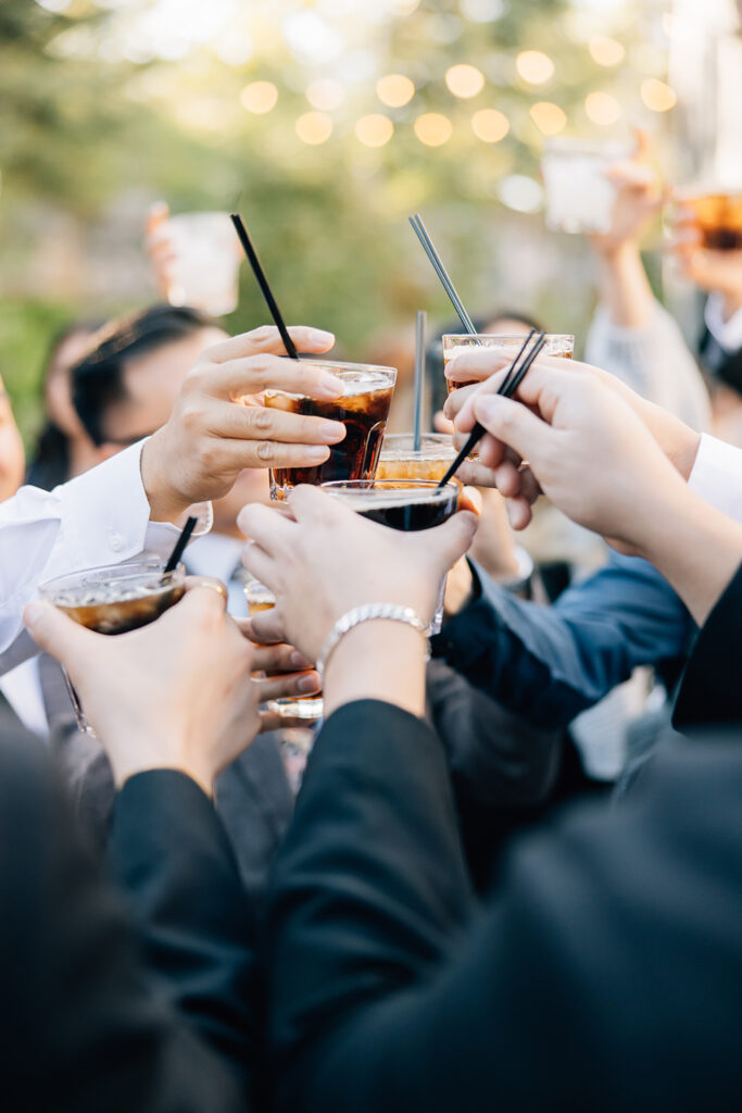 Groomsmen toast with individual drinks celebrating a couple's South Haven, Mississippi, wedding. Suits straws celebration drinks toast groomsmen details celebration special day #missippiweddingphotographer #tennesseweddingphotographer #KaileeMatsumura #Bartletttennesse #southhavenmissippi
