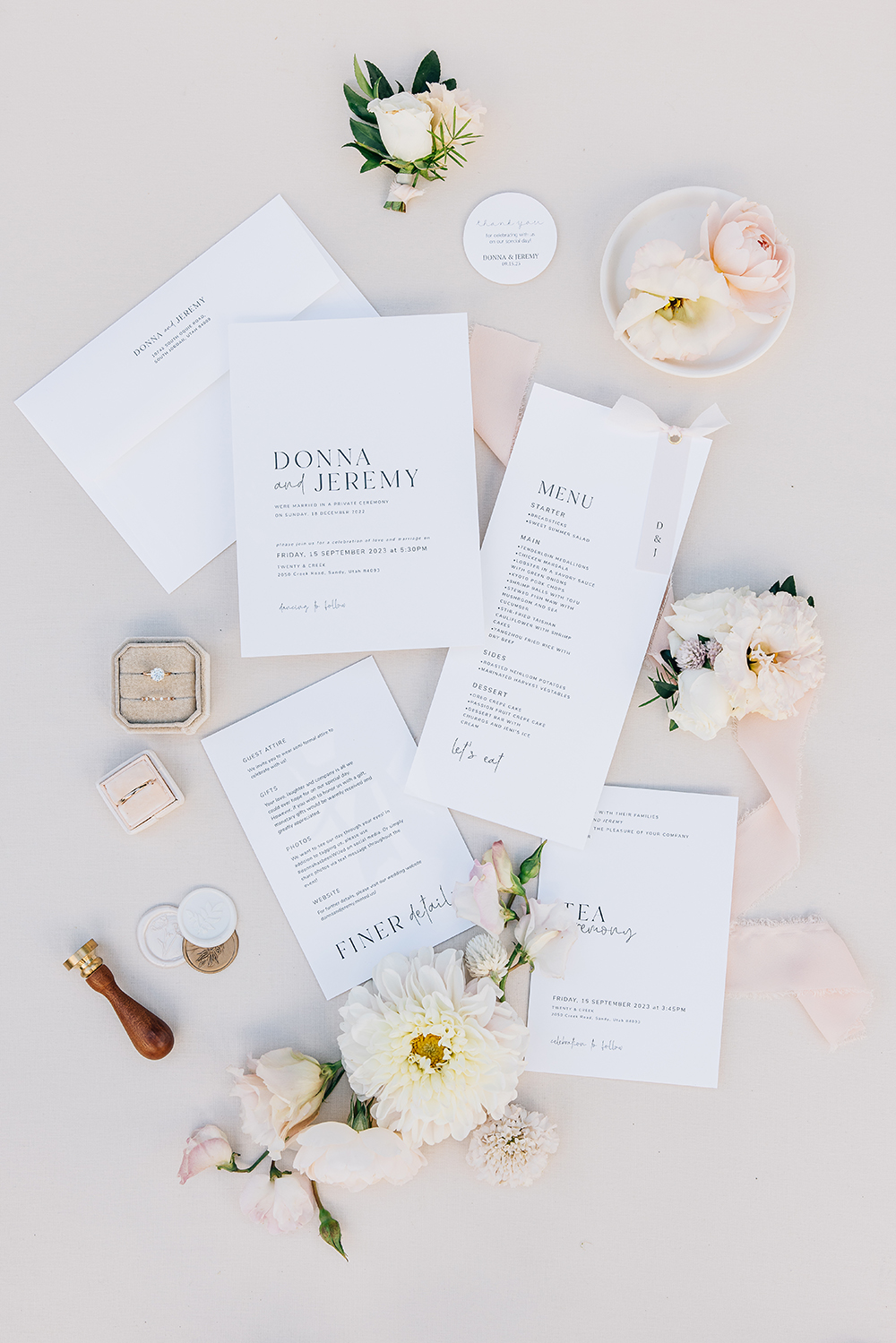 Dreamy light pink and cream flat lay of wedding day printed items, surrounded by peonies, unique details like a wax seal, and wedding rings. Menu invitation suite ceremony boutonniere wedding florals vendor Mississippi South Haven#missippiweddingphotographer #tennesseweddingphotographer #KaileeMatsumura #Bartletttennesse #southhavenmissippi

