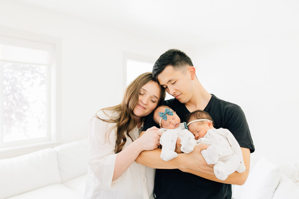 Young family with twin girls during their in home session in Memphis with Kailee Matsumura. Germantown Newborn Photographer.