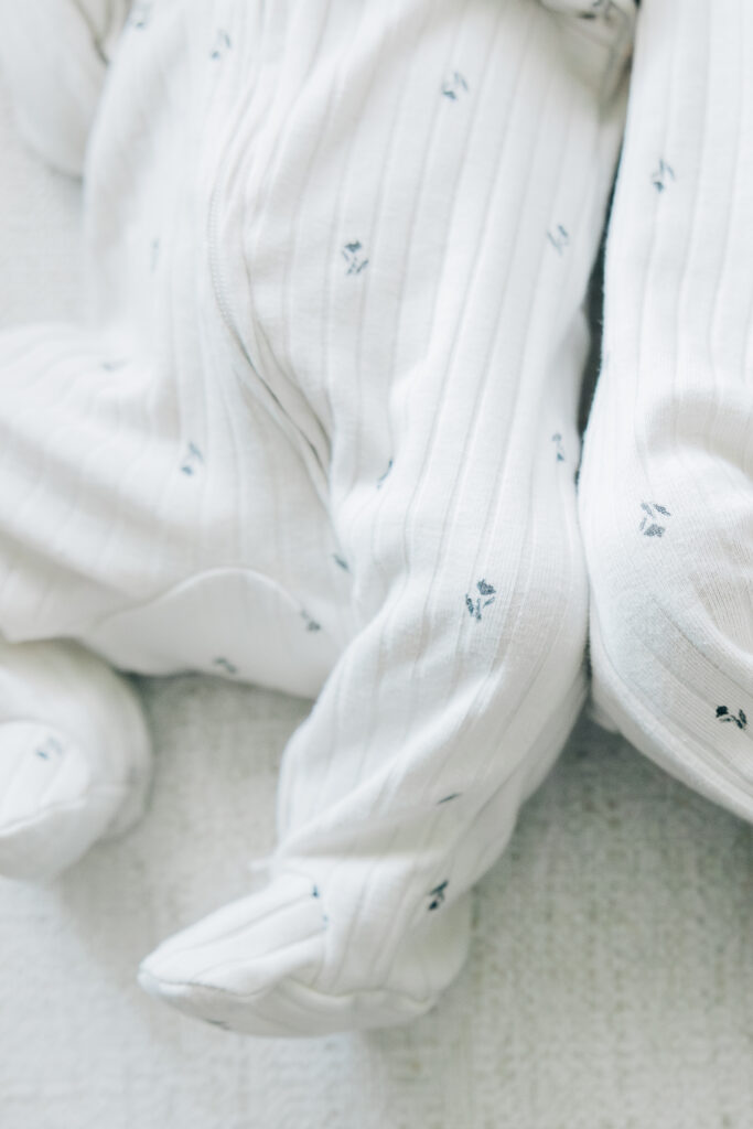 Close up of the legs and feet of a little baby. 