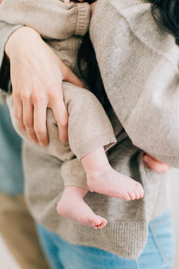 Newborn feet. Mom and baby both wearing sweaters, cozy outfits for their session in home. Memphis Newborn Photographer, Memphis Newborn Photography