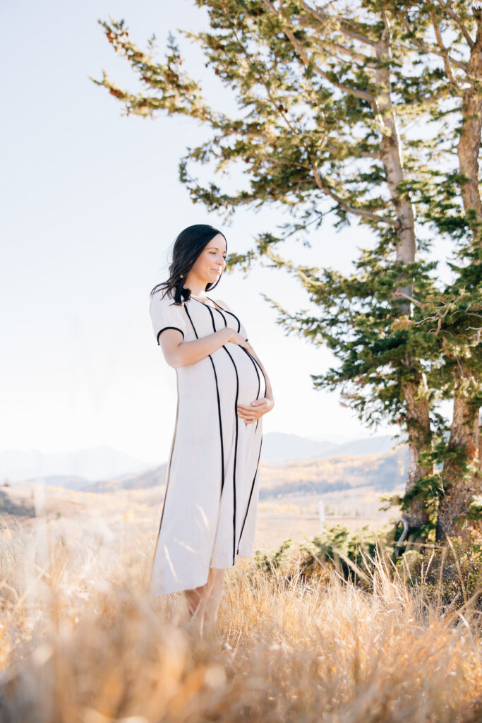 Momma looking out to the mountains holding her belly during her Memphis Maternity Photos. 