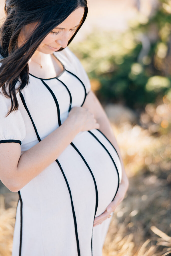 Momma before giving birth taking her Maternity pictures. Getting ready to breastfeed. 