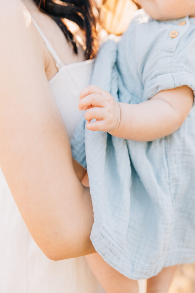 Little hand of newborn girl in Germantown, TN during an outdoor newborn photo session. 