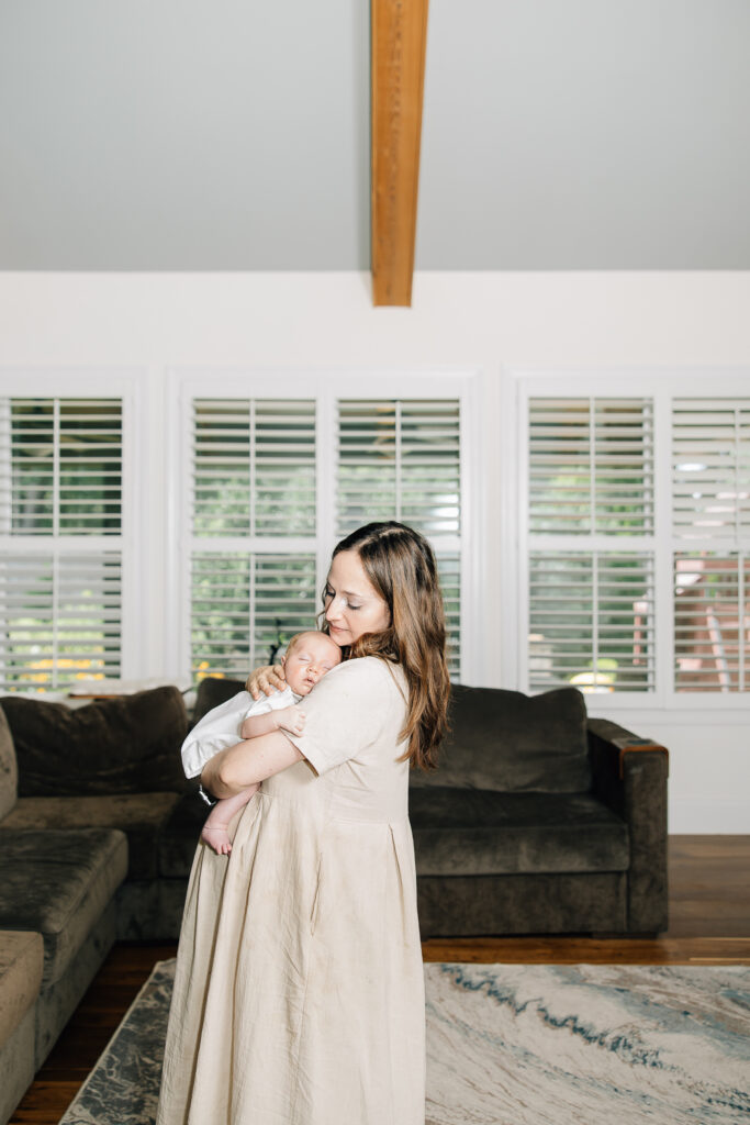 Mother and newborn baby boy in an In home session. Taken by Kailee Matsumura, a Salt Lake Family Photographer. 